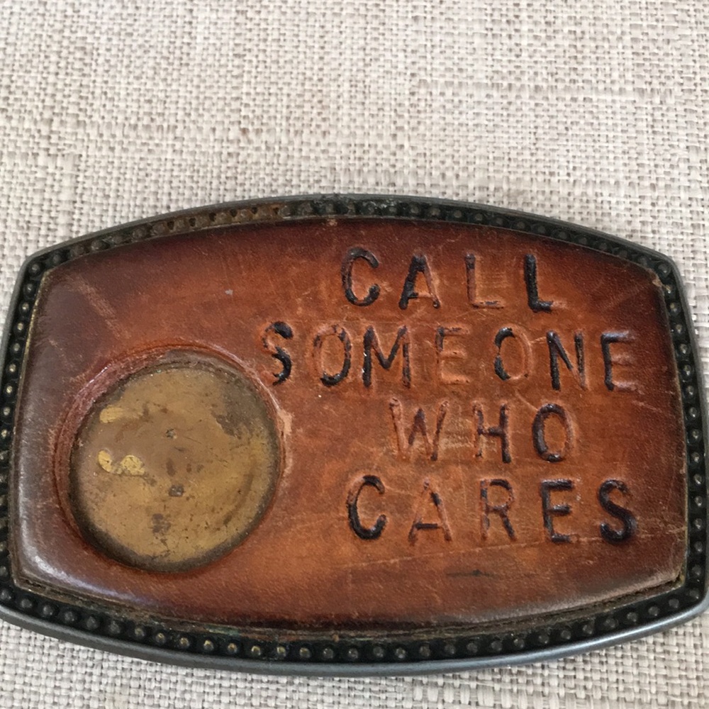 Call someone who cares belt buckle